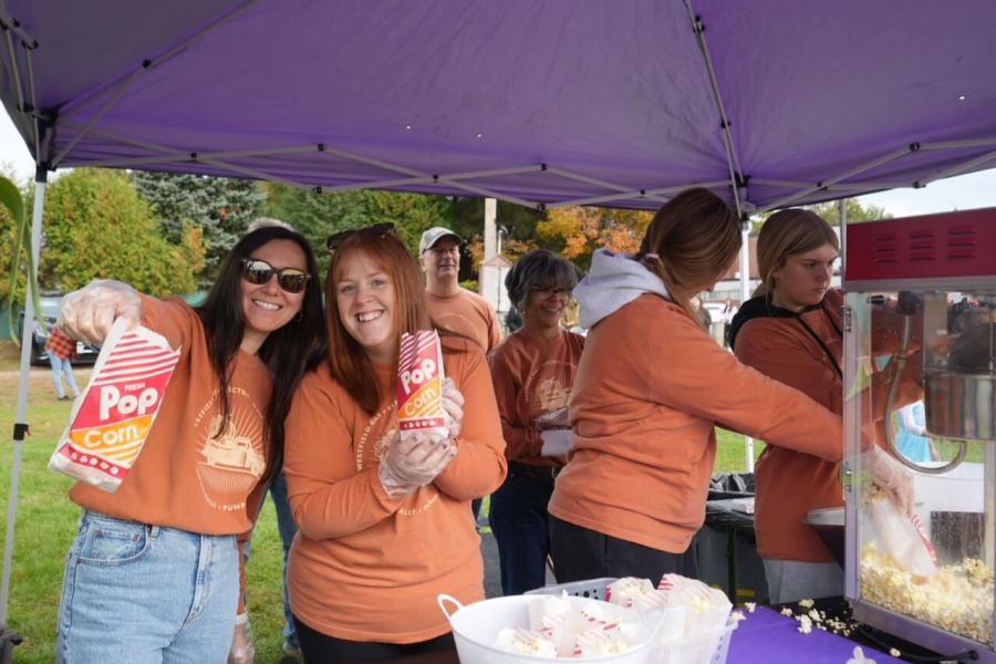 Employees work at popcorn stand